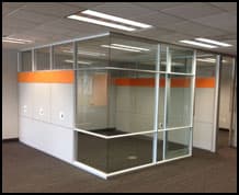 Glass-paneled demountable office wall system installation